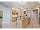 Gourmet kitchen with a large island, granite countertops, and stainless steel appliances at 50 Central Ave # 17Phb, Sarasota, FL 34236