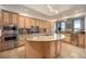Gourmet kitchen features custom cabinetry, granite countertops, stainless steel appliances, and a center island at 50 Central Ave # 17Phb, Sarasota, FL 34236