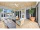 Enclosed lanai with fireplace and ample seating at 50 Central Ave # 17Phb, Sarasota, FL 34236
