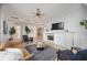 Cozy living room featuring a fireplace, modern decor, and comfortable seating at 50 Central Ave # 17Phb, Sarasota, FL 34236