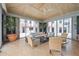 Cozy, light-filled living room with stylish furnishings and large windows offering scenic views at 50 Central Ave # 17Phb, Sarasota, FL 34236