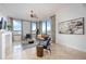 Bright living room with large windows offering a beautiful city view, elegant decor, and modern furnishings at 50 Central Ave # 17Phb, Sarasota, FL 34236