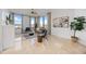 Stylish living room with large windows overlooking the city, comfortable seating, and modern artwork at 50 Central Ave # 17Phb, Sarasota, FL 34236