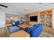 Welcoming lounge area with comfortable seating, built-in bookshelves, and a TV for relaxation at 50 Central Ave # 17Phb, Sarasota, FL 34236
