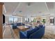 Spacious lounge area with ample seating, a cozy fireplace, expansive windows, and city views at 50 Central Ave # 17Phb, Sarasota, FL 34236