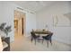 Bright home office featuring a sleek desk, modern chairs, and neutral walls at 50 Central Ave # 17Phb, Sarasota, FL 34236