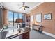 Well-appointed home office features custom cabinets, a ceiling fan, and dual desks for a flexible workspace at 50 Central Ave # 17Phb, Sarasota, FL 34236