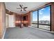 Well-lit office offering custom desk, built-ins, and city views from the expansive window at 50 Central Ave # 17Phb, Sarasota, FL 34236