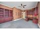 Spacious office featuring custom built-in shelving and cabinets with a large granite desk at 50 Central Ave # 17Phb, Sarasota, FL 34236