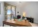 Bright office with a wood desk and balcony access with beautiful views at 50 Central Ave # 17Phb, Sarasota, FL 34236
