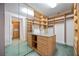 Spacious walk-in closet with custom shelving, drawers, and mirrored wall at 50 Central Ave # 17Phb, Sarasota, FL 34236
