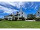 Two-story home with screened porch and manicured lawn at 13 Tidy Island Blvd # 13, Bradenton, FL 34210