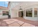 Screened porch with tile floor and ceiling fan at 5814 Fairwoods Cir, Sarasota, FL 34243