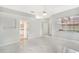 Light and airy bedroom with marble floors and an ensuite bathroom at 5814 Fairwoods Cir, Sarasota, FL 34243