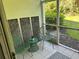 Relaxing screened-in porch with outdoor furniture and lush backyard views at 3604 54Th W Dr # 103, Bradenton, FL 34210
