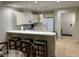 Kitchen with breakfast bar, white cabinets, and ample counter space at 3604 54Th W Dr # 103, Bradenton, FL 34210