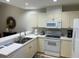 Well-equipped kitchen featuring ample cabinetry and modern appliances at 3604 54Th W Dr # 103, Bradenton, FL 34210