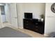 Spacious bedroom with a dresser and access to the laundry room at 3604 54Th W Dr # 103, Bradenton, FL 34210