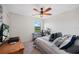 Bedroom with a queen bed, window, and workspace at 17006 Blue Ridge Pl, Lakewood Ranch, FL 34211