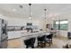 Spacious kitchen with white cabinets, granite countertops, and island at 17006 Blue Ridge Pl, Lakewood Ranch, FL 34211