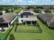 Aerial view of the house, showcasing the backyard and solar panels at 17006 Blue Ridge Pl, Lakewood Ranch, FL 34211