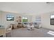 Spacious bonus room with a couch, a work area and plenty of natural light at 17006 Blue Ridge Pl, Lakewood Ranch, FL 34211