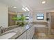 Elegant bathroom with granite double vanity, soaking tub, and walk-in shower at 17006 Blue Ridge Pl, Lakewood Ranch, FL 34211