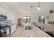 Bright kitchen with an island, white cabinets, and granite countertops at 17006 Blue Ridge Pl, Lakewood Ranch, FL 34211