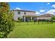 Two story home with fenced backyard, covered patio, and solar panels at 17006 Blue Ridge Pl, Lakewood Ranch, FL 34211