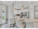 Breakfast bar with two seats looking into the living room at 5732 Puccini St, Nokomis, FL 34275