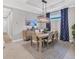 Bright dining room with hardwood floors and modern light fixture at 5732 Puccini St, Nokomis, FL 34275
