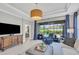 Spacious living area with access to the pool and lanai at 5732 Puccini St, Nokomis, FL 34275