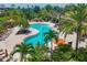 Relaxing pool area with lounge chairs and palm trees at 5732 Puccini St, Nokomis, FL 34275