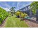 Landscaped backyard with lush greenery and a view of the pool at 5732 Puccini St, Nokomis, FL 34275