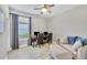 Home office featuring a workspace for two and a comfortable lounge area at 5732 Puccini St, Nokomis, FL 34275