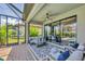 Relaxing covered patio with comfortable seating overlooking the pool area at 5732 Puccini St, Nokomis, FL 34275