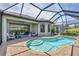 Inviting kidney-shaped pool with a screened enclosure and patio at 5732 Puccini St, Nokomis, FL 34275