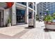 Modern building exterior with attractive landscaping and signage at 50 Central Ave # 17Phb, Sarasota, FL 34236