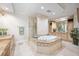 Spa-like bathroom with a large soaking tub and double vanity at 50 Central Ave # 17Phb, Sarasota, FL 34236