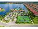 Community overview showing amenities such as tennis courts and parking at 118 Veraza Ct, Nokomis, FL 34275