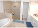 Elegant bathroom with soaking tub, shower, and double vanity at 118 Veraza Ct, Nokomis, FL 34275