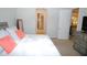 Bright bedroom with large bed and view of bathroom at 118 Veraza Ct, Nokomis, FL 34275