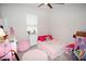 Charming bedroom with a pink theme and plenty of storage at 118 Veraza Ct, Nokomis, FL 34275