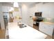 Modern kitchen with white cabinets and island at 118 Veraza Ct, Nokomis, FL 34275