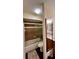 Bathroom with tub/shower and updated vanity at 6033 34Th W St # 1, Bradenton, FL 34210