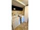 Laundry room with washer, dryer, and shelving at 6033 34Th W St # 1, Bradenton, FL 34210