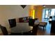 Bright dining area with glass table and leather chairs at 6033 34Th W St # 1, Bradenton, FL 34210