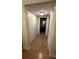 Hallway with tile flooring and access to closets and bathroom at 6033 34Th W St # 1, Bradenton, FL 34210