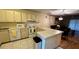 Kitchen features a breakfast bar and white appliances at 6033 34Th W St # 1, Bradenton, FL 34210