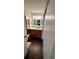 Updated bathroom with dark wood vanity, tile floor, and large mirror at 6033 34Th W St # 1, Bradenton, FL 34210